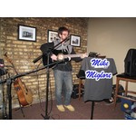 Mike Miglore on acoustic guitar/vocals